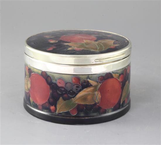 A Moorcroft pomegranate pattern circular trinket box, diameter 16.5cm